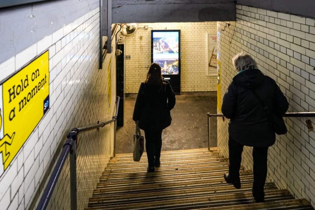 Passengers at the stairs of the Lewisham subway