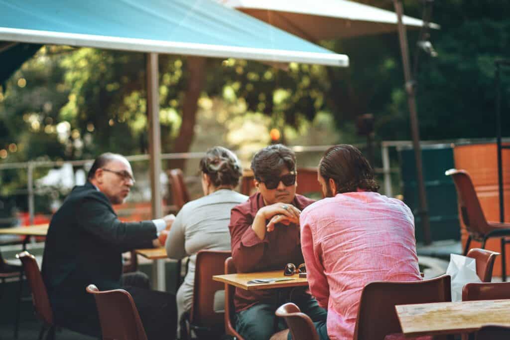 People in an outdoor dining in the concept of services and amenities in Lewisham.