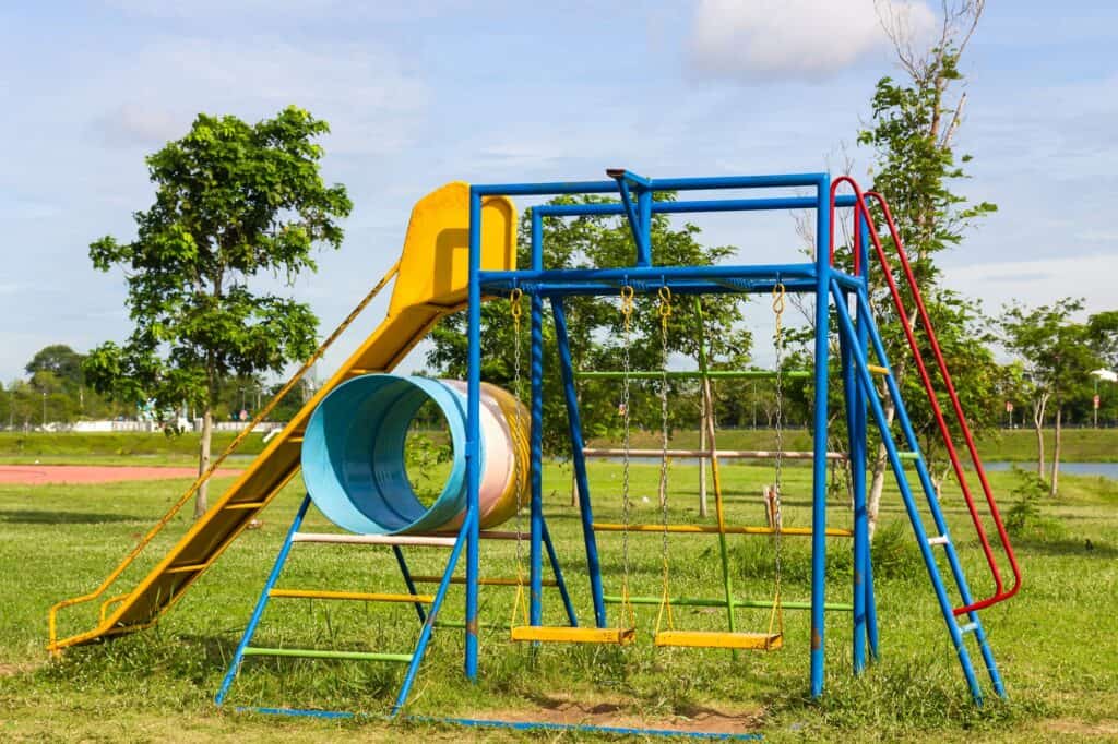 Children's playground and a lake in the background