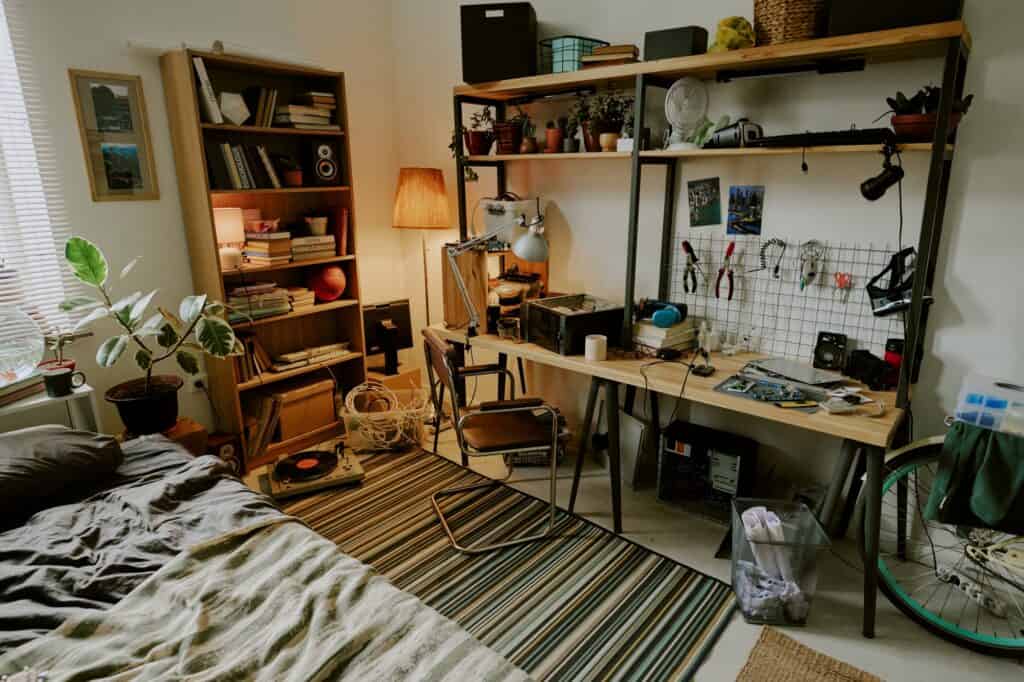 A dorm room full of stuff before the relocation in the concept of 'How to Pack Household Items Safely for a Move to Lewisham'.